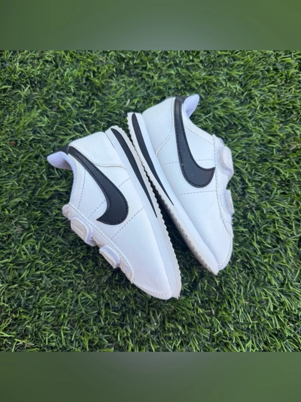 Nike Kids White Sneakers with Black Swoosh and Velcro